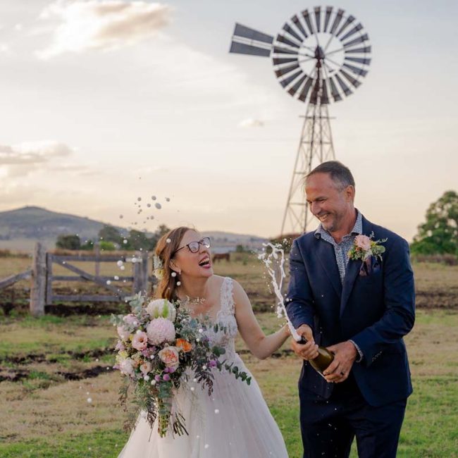 Wedding Photography bride and groom celebrate with champagne