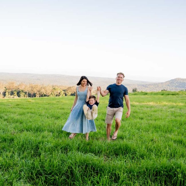 Family Photography mum and dad swinging son